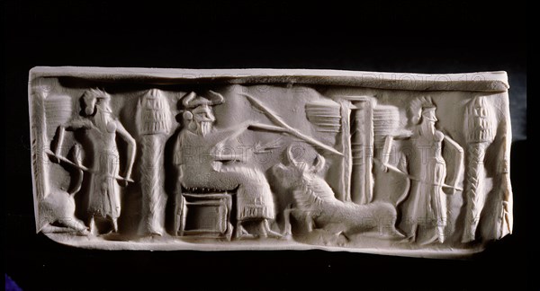 Modern impression of an Akkadian cylinder seal inscribed with a scene of a seated deity wearing horned headdress, with attendant and a recumbent bull supporting a winged gate