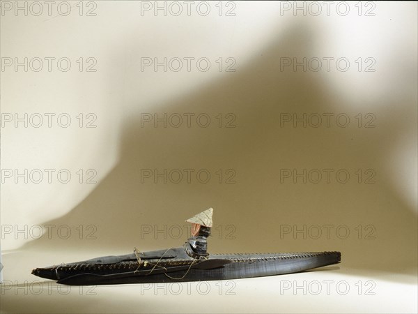 Model of an Aleut hunter in his kayak