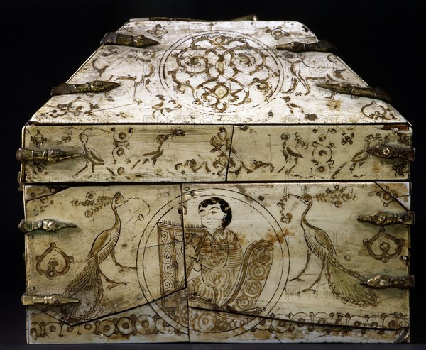 An ivory covered wooden casket with a painted design including two peacocks and a seated musician playing a harp