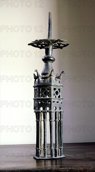 A hexagonal candlestick with crenellations like those of the Great Mosque of Cordoba