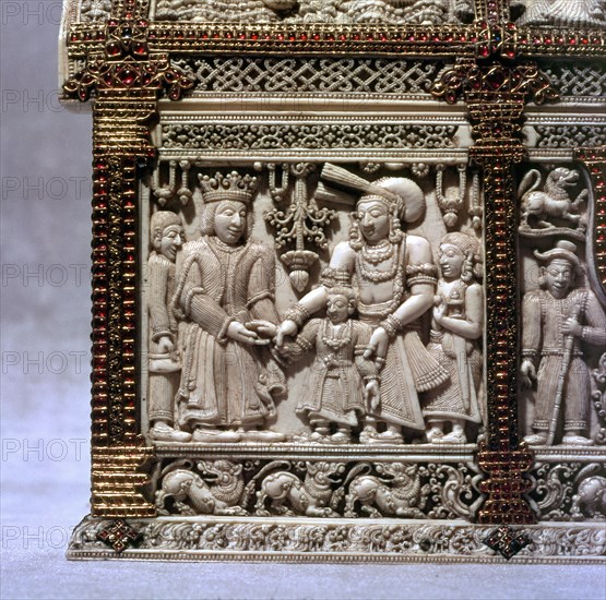 Detail of low relief carving on an ivory casket decorated with gold and rubies