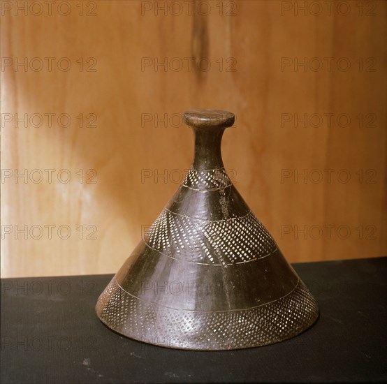 Cone shaped cover for a vessel finely shaped decorated Meroitic graphite ware