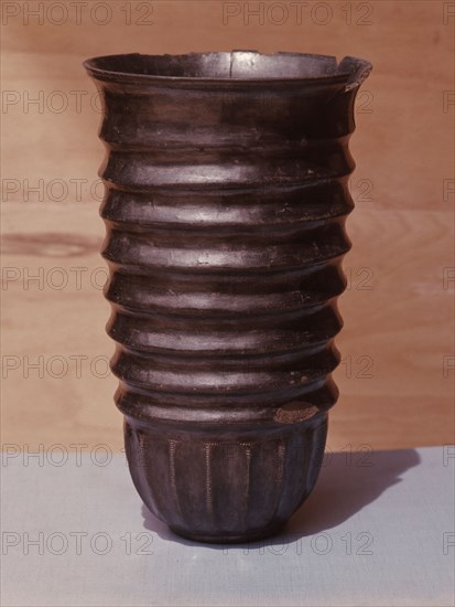 Burnished black ware ribbed pot