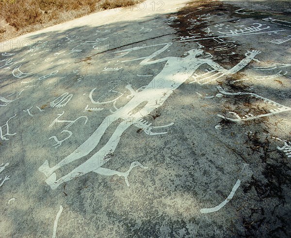 Near Litsleby, carved on top of older boats, is a man, larger than life, with an erect phallus and brandishing a spear