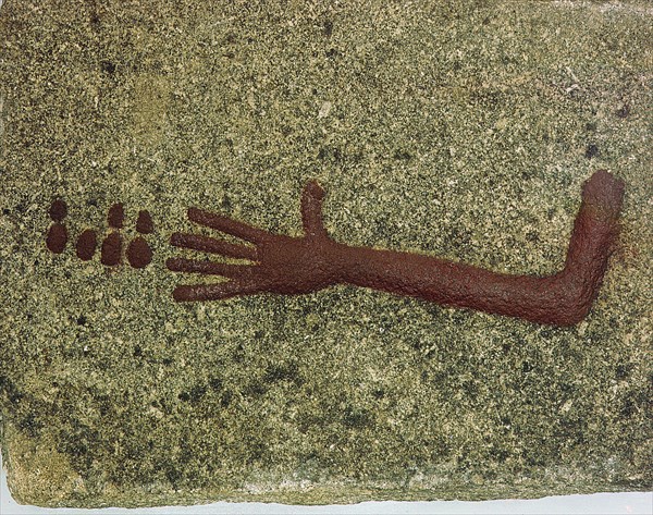 Stone with low relief carving of an arm with seven small discs, perhaps coins or gaming pieces