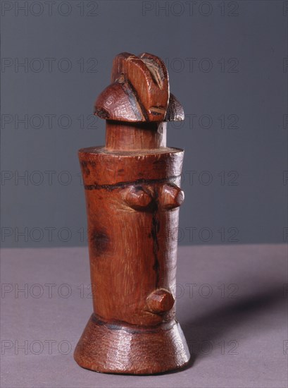 Among a number of cultures in coastal Tanzania, wooden figures of this cylindrical form, known as Mwana Hiti, were worn by girls undergoing initiation