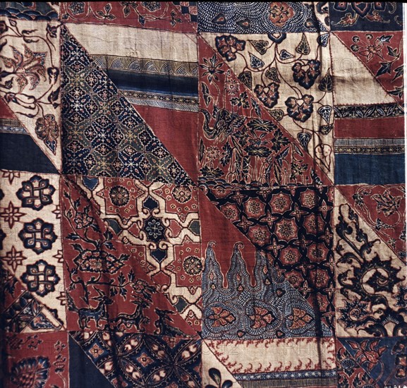 Detail of a cotton batik kain with imitation patchwork design, copying the garments of poor priests