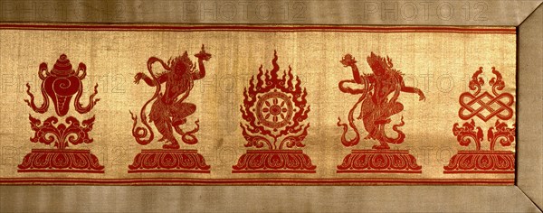 Sino Tibetan silk and gold brocade altar cloth depicting eight auspicious emblems interspersed by puja devis (offering goddesses) who offer gifts to the five Dhyani Buddhas, or Buddhas of meditation