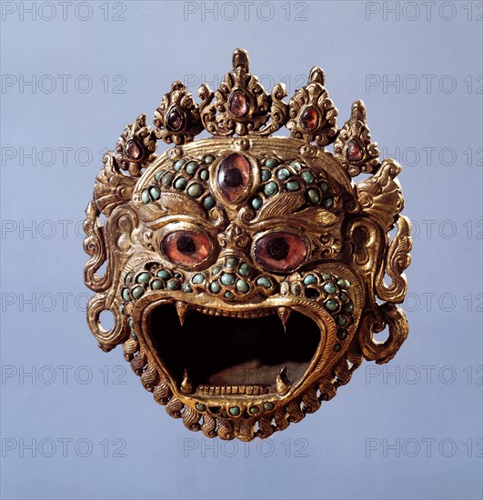 A holy water vessel in the form of a demonic face
