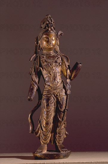 Statue of Bodhisattva Guanyin, Goddess of Mercy, decorated with chased ornaments