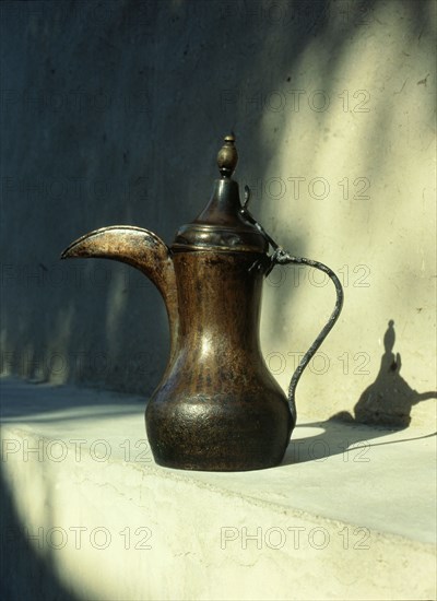 Brass hornbill spouted coffee pot, dallah, of the type once found throughout the Emirates