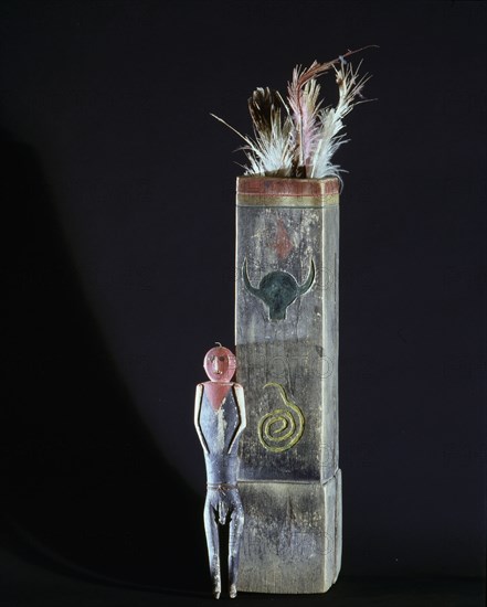 Carved spirit figure and bark headdress of the Midewiwin society