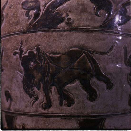 Detail of ornaments on a stoneware pot with an elephant theme