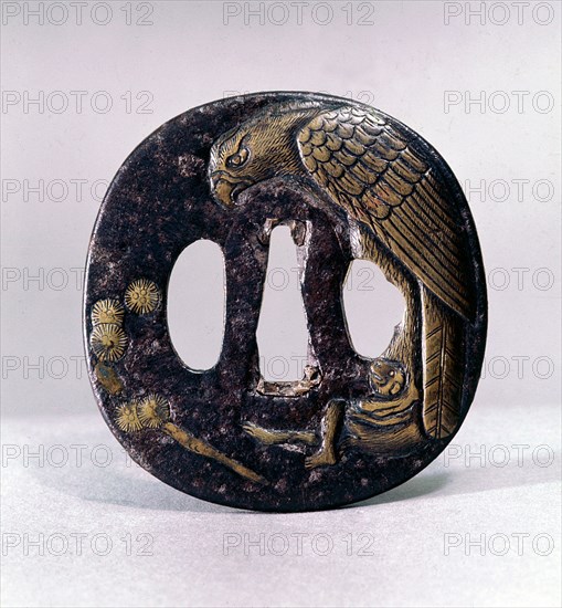 Tsuba (sword guard) engraved with an eagle grasping a monkey in its talons