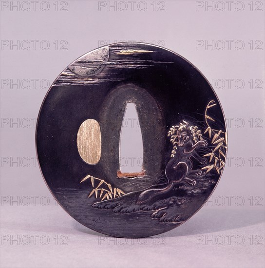 Tsuba (sword guard) decorated with a magic fox disguising itself as a woman