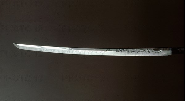 Sword (katana) blade carved with  an ascending dragon