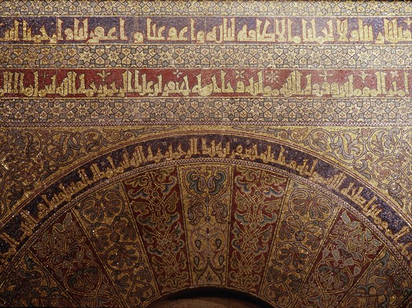Detail of calligraphy and decorative mosaics above the door of the Iman in the Great Mosque of Cordoba