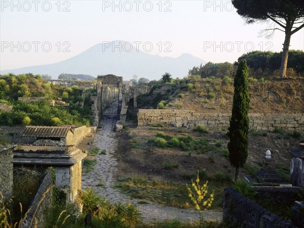 Tombs beyond the walls of Pompeii, with Vesuvius in the background