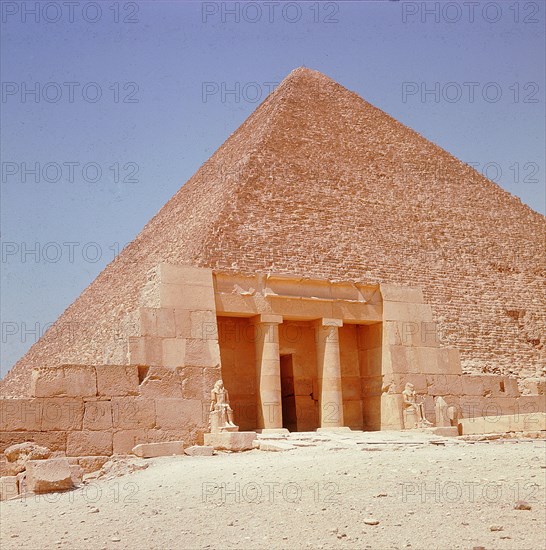 Near the southeast corner of the pyramid of Cheops stands the restored columned portico of the family tomb of Seshemnefer