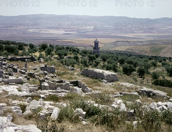 A Numidian Berber tomb built by Punic craftsmen seen from the ruins of the Roman city of Dougga