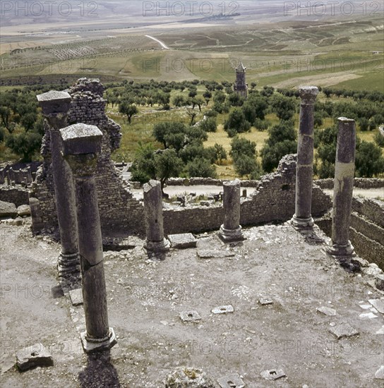 A Numidian Berber tomb built by Punic craftsmen seen from the ruins of the Roman city of Dougga