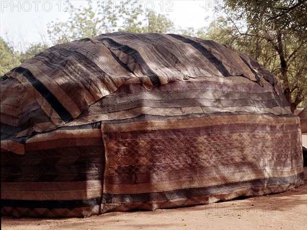 A tent walled with woven fibre mats in the Niger capital, Niamey