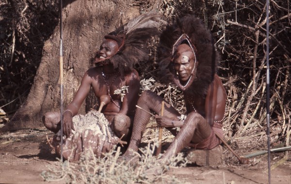 The hairstyle and beadwork of these Masai men indicate their status as warriors