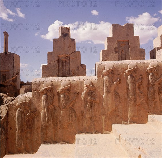 A detail of a relief carving on the staircase leading to the Tripylon at Persepolis, depicting the procession of Medes and Persians