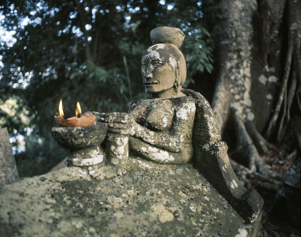 A stone figure on an old Batak tomb