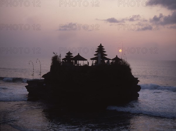 Tanah Lot, a small temple on a rocky outcrop cut off at high tide, is one of the most spectacular and popularof the island's thousands of temples