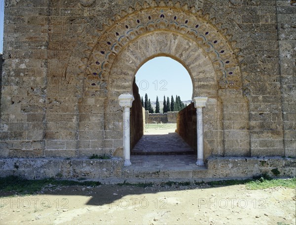 The gateway into the courtyard of theruined mosque of al-Mansura is set in the base of the minaret