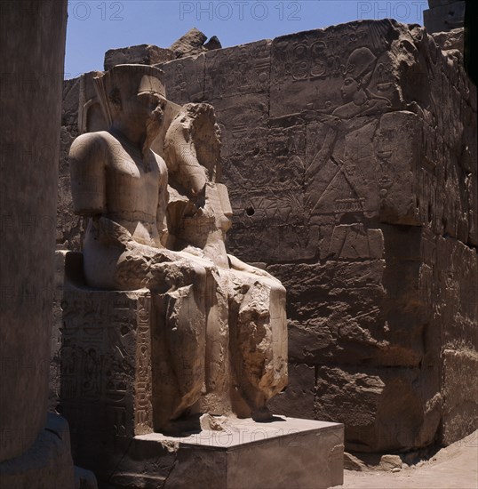 The seated double statues of the gods Amun and Mut, from the processional colonnade of Amenophis III