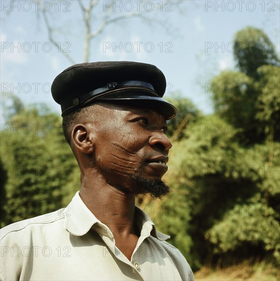 Yoruba man with facial scarification of a type known as abasa, worn by members of some families in the Oyo region