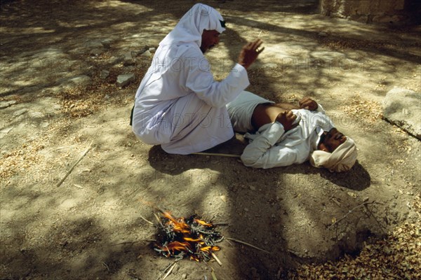 "Burning" or cauterizing with hot irons