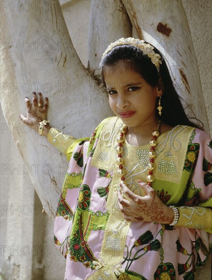 Geometric and floral decorative henna patterns were applied to adorn the hands and feet of young women on occasions such as weddings