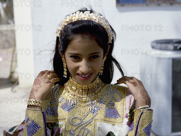 Geometric and floral decorative henna patterns were applied to adorn the hands and feet of young women on occasions such as weddings