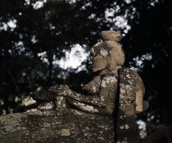 A stone figure on an old Batak tomb