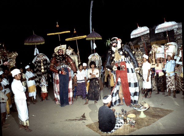 Before and after each masquerade the masks are brought to the temple where they are sprinkled with holy water by a priest