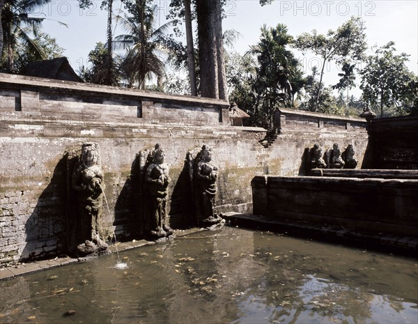 Heavenly nymphs spout water at the sacred baths of the Goa Gajah, Elephant Cave