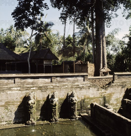 Heavenly nymphs spout water at the sacred baths of the Goa Gajah, Elephant Cave