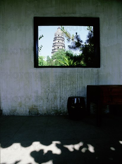 The pagoda of Yunyam temple, Hu Qui (Tiger) Hill, Suzhou, seen through the window of a covered corridor of Xiaowu House