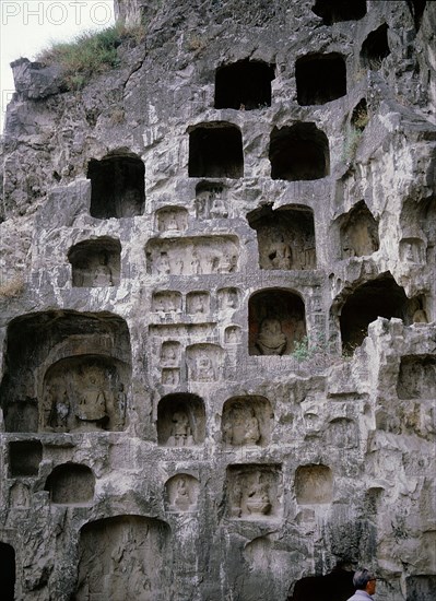 The Longmen cave-temple complex which extends for about 1000m along the Yi River