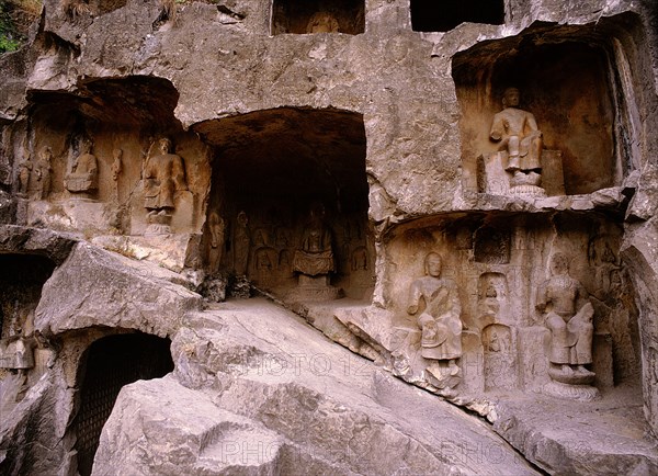 The Longmen cave-temple complex which extends for about 1000m along the Yi River