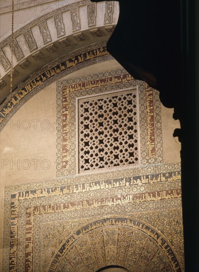 The grille and calligraphy in mosaic above the doorway to the treasury in the Great Mosque at Cordoba   Spain