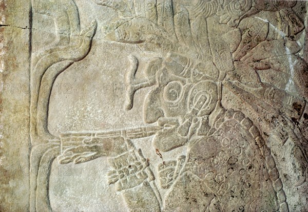 Detail of a bas relief sculpture showing the smoking God L, associated with commerce and the underworld