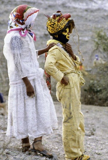 Acatlan boys, one dressed as a jaguar the other as a girl, in a fertility and rain making festival dating from the pre-Columbian times