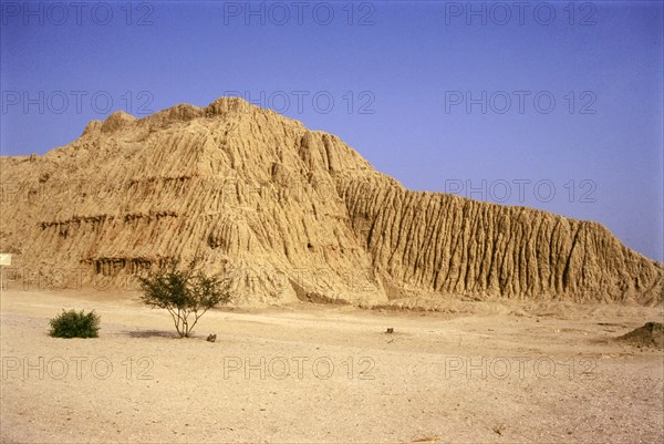 View of major eroded mud-brick pyramid at Mochica site of Tucume