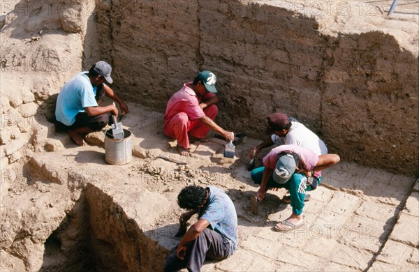 Archaeologists at work on the excavation of the temple-tomb pyramid at Sipan, Lambayeque Valley