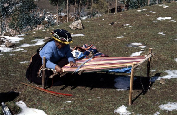 Quechua 'Inca' woman weaving on a horizontal single-heddle loom