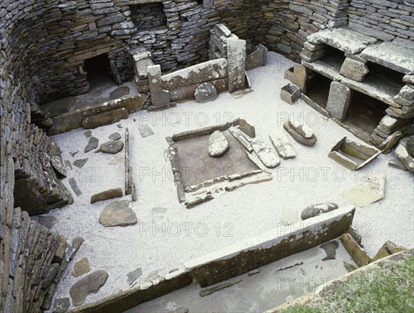 View of the interior of House 1, through the door